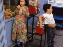 Untitled, New York (boy and girl leaning on candy machine), 1971